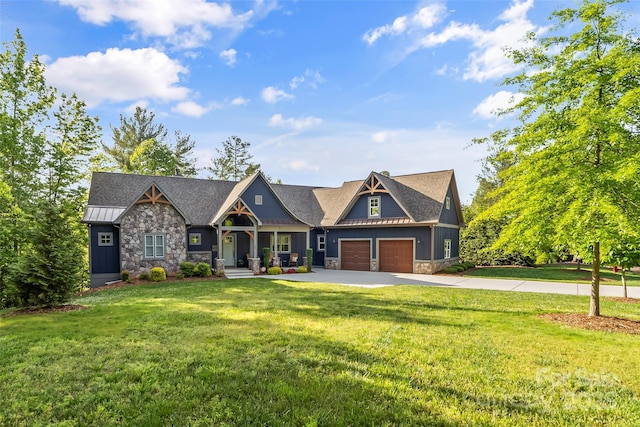 1289 Northview Dr, Morganton, NC 28655 - craftsman-style house featuring a standing seam roof, a front yard, a garage, concrete driveway, and stone siding