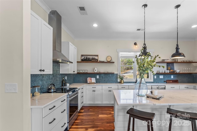 1289 Northview Dr, Morganton, NC 28655 - kitchen featuring wall chimney range hood, open shelves, stainless steel appliances, and a kitchen bar