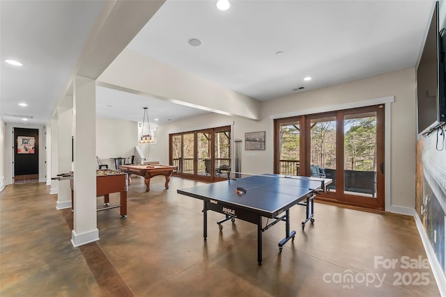 1289 Northview Dr, Morganton, NC 28655 - game room featuring french doors, billiards, finished concrete flooring, and baseboards