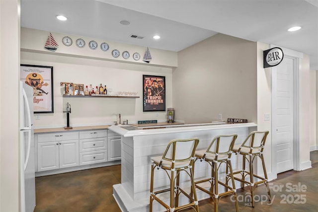 1289 Northview Dr, Morganton, NC 28655 - bar with wet bar, visible vents, a sink, freestanding refrigerator, and recessed lighting