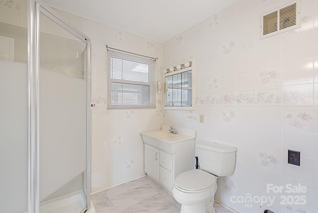 full bath with visible vents, a shower stall, marble finish floor, toilet, and vanity