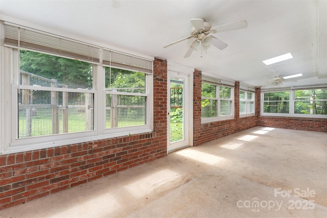 31 Vista Dr, Candler, NC 28715 - unfurnished sunroom with brick wall, lofted ceiling, and a skylight