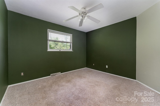 31 Vista Dr, Candler, NC 28715 - empty room featuring carpet floors, baseboards, and a ceiling fan