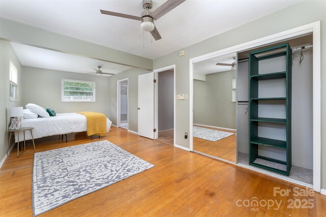 31 Vista Dr, Candler, NC 28715 - bedroom with light wood-type flooring, baseboards, and ceiling fan