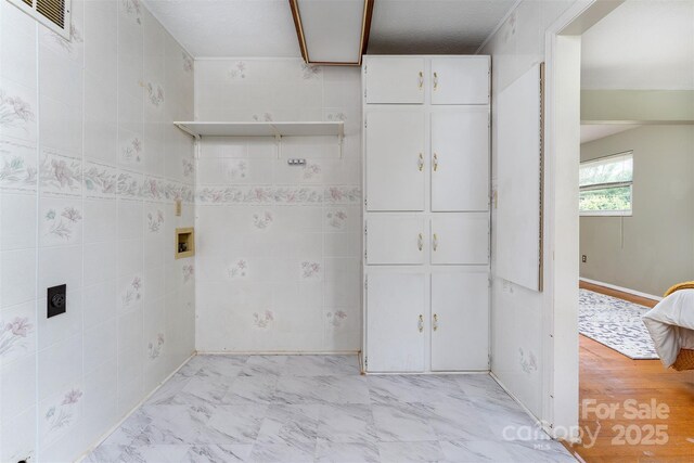31 Vista Dr, Candler, NC 28715 - laundry area featuring light marble finish floors