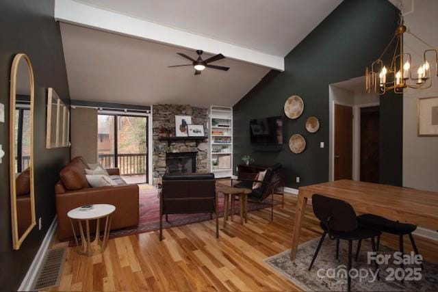 36 Poplar Ct, Fletcher, NC 28732 - living area featuring light wood finished floors, ceiling fan, a fireplace, and a chandelier