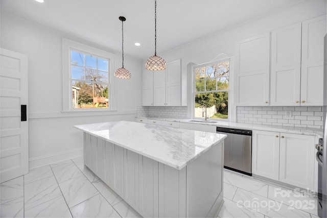 kitchen featuring backsplash, stainless steel dishwasher, marble finish floor, and a center island