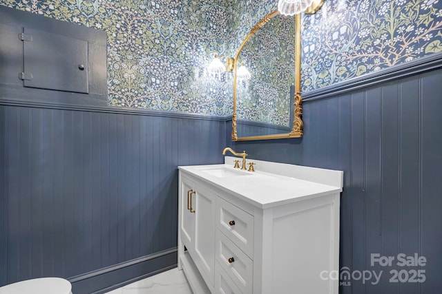 bathroom with vanity and marble finish floor