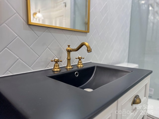 room details featuring backsplash and vanity