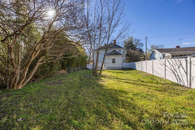 view of yard featuring fence