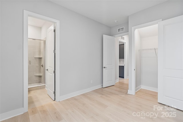 1132 Meander Ln, Waxhaw, NC 28173 - unfurnished bedroom featuring light wood-style floors and a closet