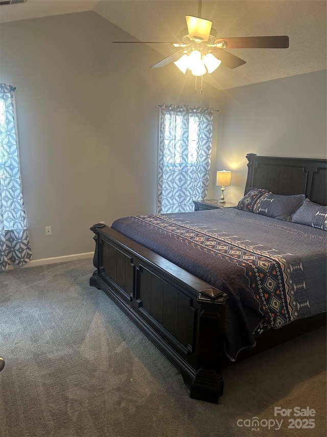 bedroom with carpet floors, baseboards, ceiling fan, and vaulted ceiling