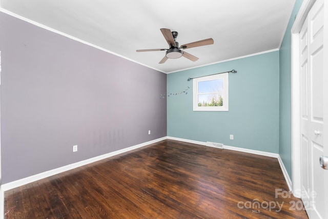 unfurnished bedroom with visible vents, crown molding, ceiling fan, baseboards, and wood finished floors