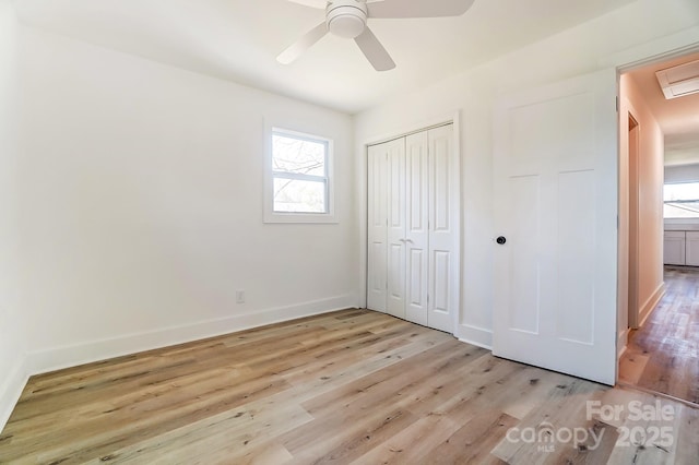 1116 Carolina Ave, Rock Hill, SC 29730 - unfurnished bedroom featuring light wood-style flooring, a closet, baseboards, and multiple windows
