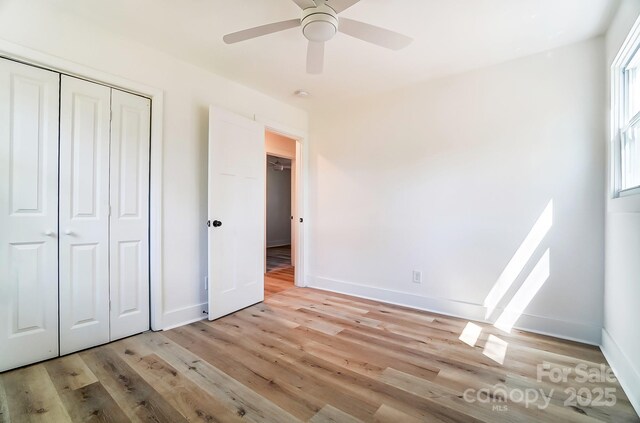 1116 Carolina Ave, Rock Hill, SC 29730 - unfurnished bedroom with a closet, a ceiling fan, baseboards, and light wood-type flooring