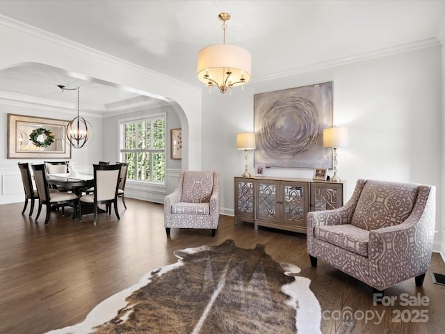 604 Wisteria Walk Way, Fort Mill, SC 29715 - living area with arched walkways, a chandelier, wood finished floors, and crown molding