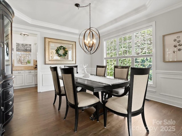 604 Wisteria Walk Way, Fort Mill, SC 29715 - dining space with a decorative wall, a chandelier, crown molding, dark wood-type flooring, and a wainscoted wall