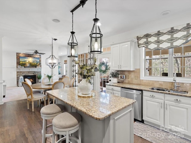 604 Wisteria Walk Way, Fort Mill, SC 29715 - kitchen with dishwasher, a sink, ceiling fan, and light stone counters