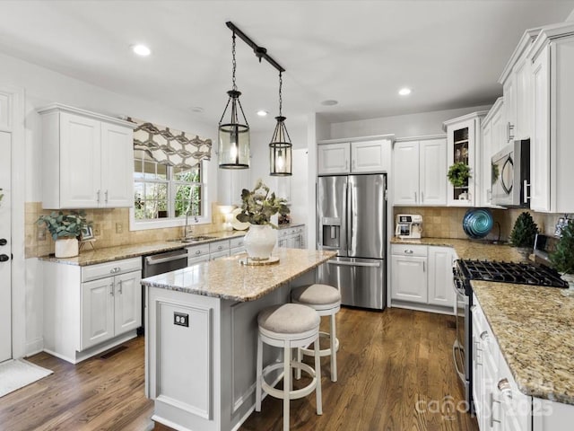 604 Wisteria Walk Way, Fort Mill, SC 29715 - kitchen featuring appliances with stainless steel finishes, a sink, white cabinetry, a kitchen island, and recessed lighting