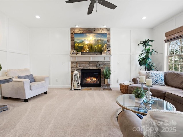 604 Wisteria Walk Way, Fort Mill, SC 29715 - carpeted living area with a decorative wall, a ceiling fan, a stone fireplace, and recessed lighting
