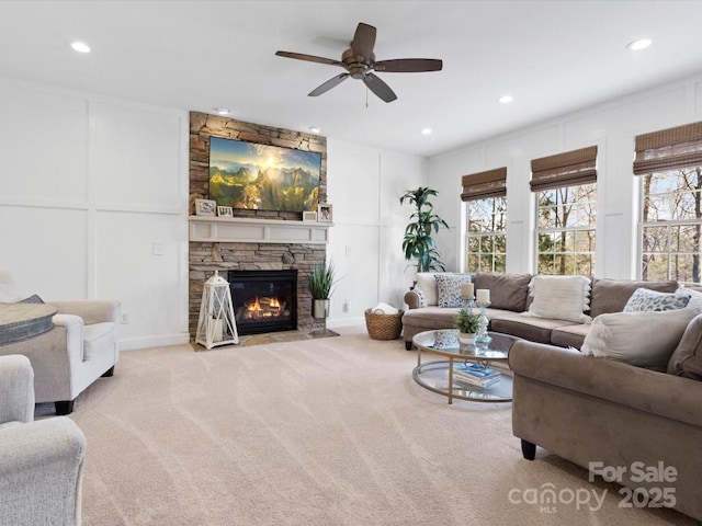 604 Wisteria Walk Way, Fort Mill, SC 29715 - carpeted living area featuring a decorative wall, a ceiling fan, recessed lighting, and a stone fireplace