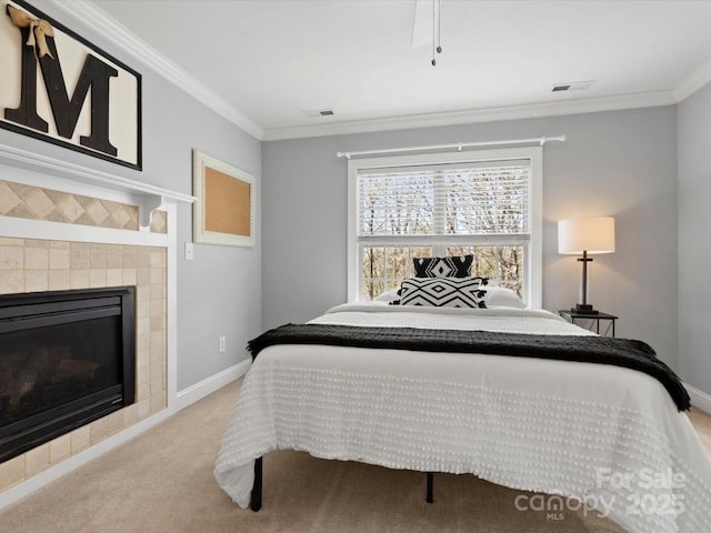 604 Wisteria Walk Way, Fort Mill, SC 29715 - carpeted bedroom with crown molding, baseboards, and a tiled fireplace