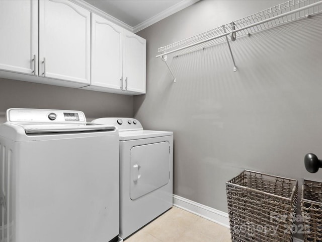 604 Wisteria Walk Way, Fort Mill, SC 29715 - laundry area with independent washer and dryer, cabinet space, ornamental molding, baseboards, and light tile patterned floors
