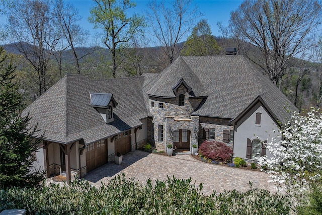 349 Stoneledge Trl, Arden, NC 28704 - french country style house with roof with shingles, stucco siding, driveway, stone siding, and an attached garage