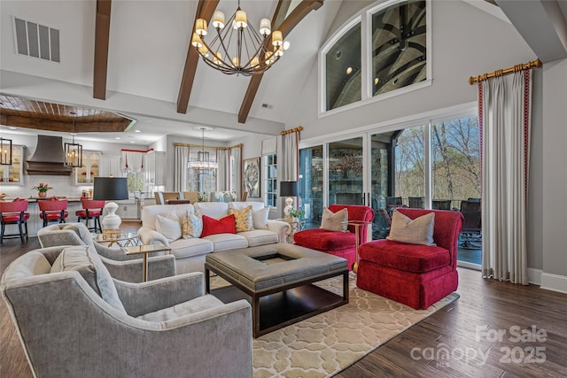 349 Stoneledge Trl, Arden, NC 28704 - living area featuring beamed ceiling, high vaulted ceiling, visible vents, a chandelier, and wood finished floors