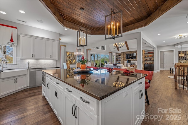 349 Stoneledge Trl, Arden, NC 28704 - kitchen with visible vents, wooden ceiling, a notable chandelier, a sink, and open floor plan