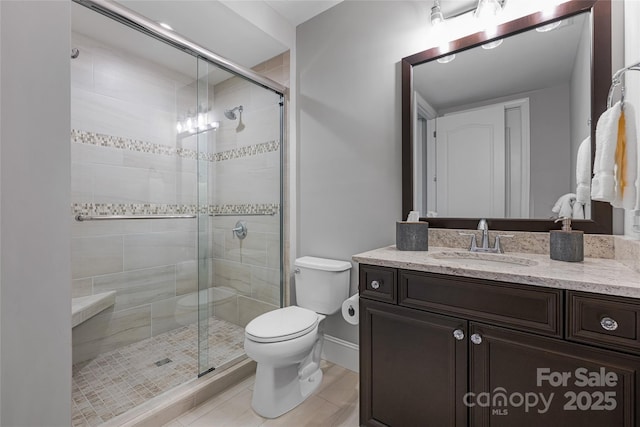 349 Stoneledge Trl, Arden, NC 28704 - bathroom featuring baseboards, toilet, a shower stall, vanity, and tile patterned floors