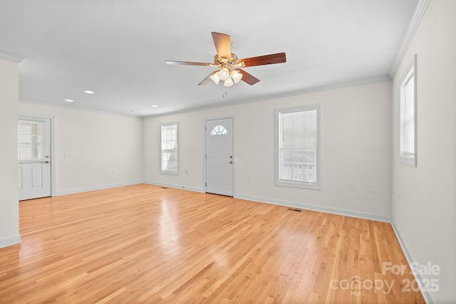 foyer featuring baseboards, a ceiling fan, crown molding, and light wood finished floors