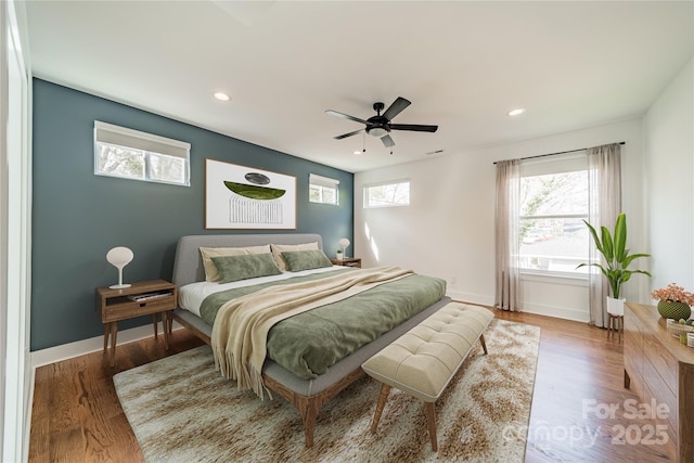 bedroom with visible vents, baseboards, ceiling fan, wood finished floors, and recessed lighting