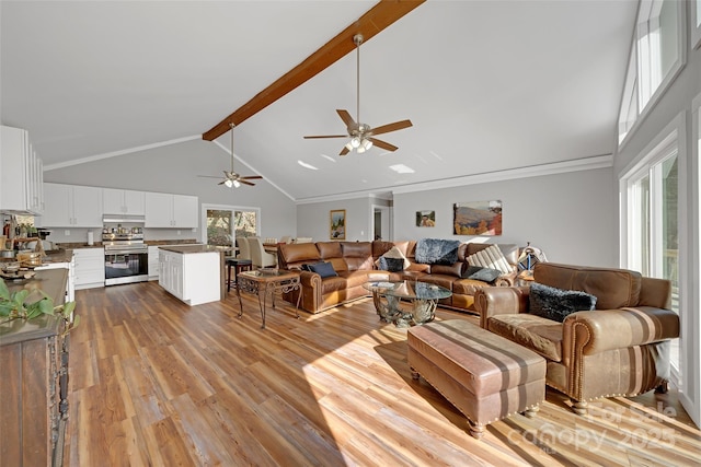 living room featuring high vaulted ceiling, wood finished floors, a ceiling fan, and beamed ceiling