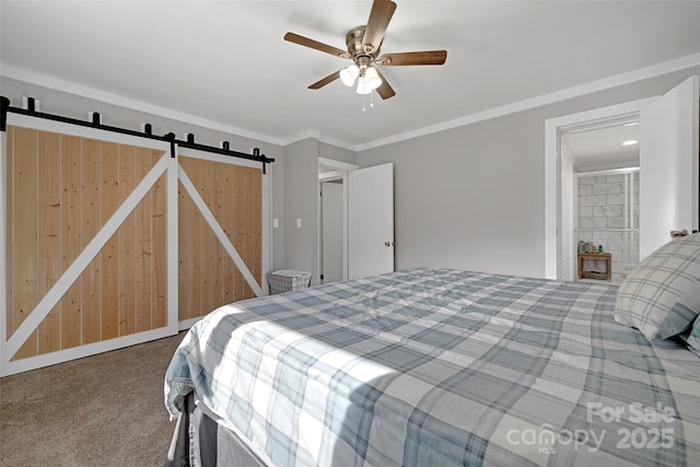 bedroom with a barn door, carpet flooring, a ceiling fan, and crown molding