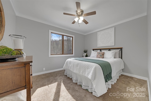 carpeted bedroom featuring crown molding and baseboards