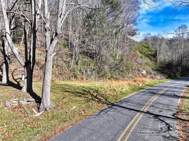 view of road featuring a view of trees