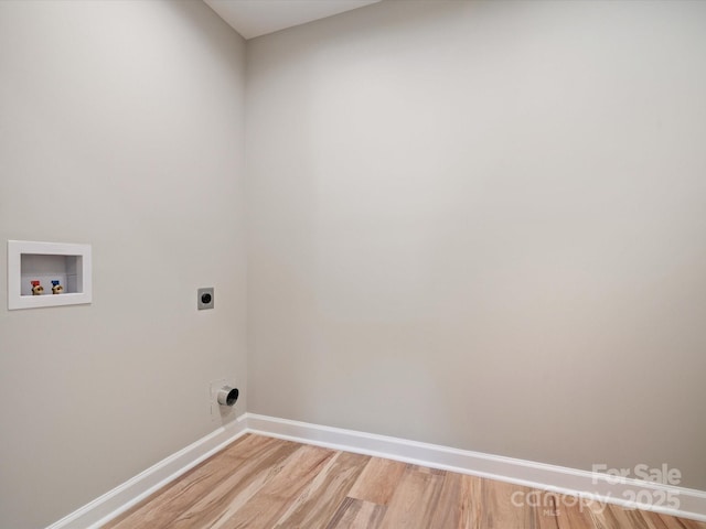 laundry room featuring electric dryer hookup, laundry area, baseboards, light wood-style floors, and hookup for a washing machine