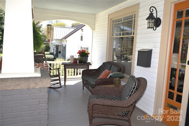wooden terrace with a porch