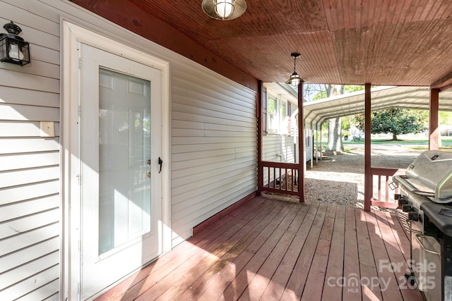 wooden deck with grilling area