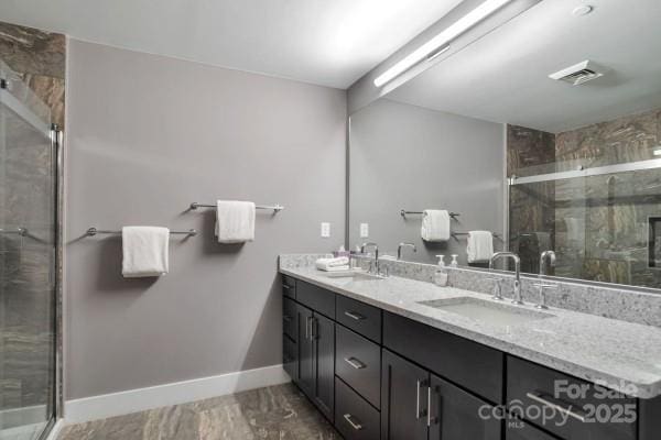45 Asheland Ave Unit 500, Asheville, NC 28801 - full bath with a shower stall, double vanity, and a sink