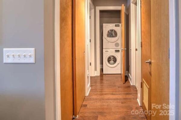45 Asheland Ave Unit 500, Asheville, NC 28801 - hallway with stacked washer / dryer and wood finished floors