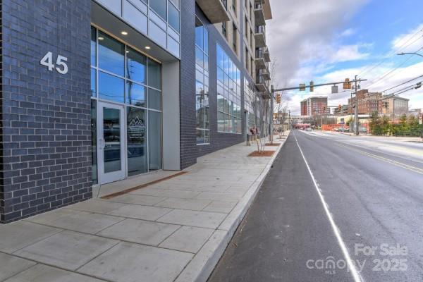 45 Asheland Ave Unit 500, Asheville, NC 28801 - view of street with curbs, traffic lights, street lights, and sidewalks