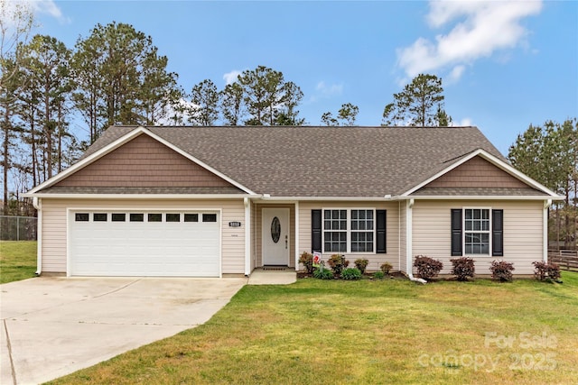 ranch-style house with fence, driveway, a front yard, and a garage