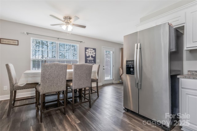 dining area with baseboards, dark wood-style flooring, and a ceiling fan