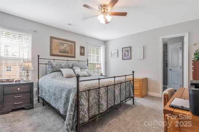 bedroom featuring baseboards, visible vents, ceiling fan, and carpet flooring