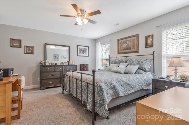 bedroom featuring light carpet, baseboards, visible vents, and ceiling fan