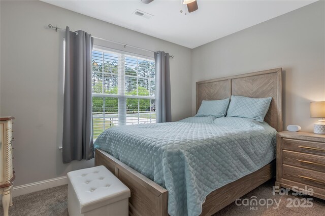 bedroom with baseboards, ceiling fan, visible vents, and carpet