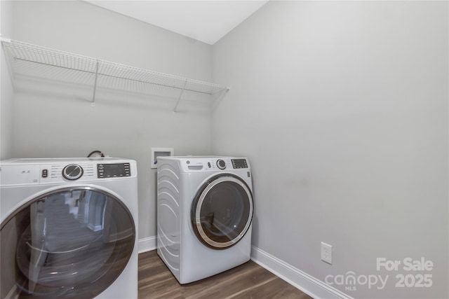 laundry room featuring independent washer and dryer, dark wood-style floors, baseboards, and laundry area