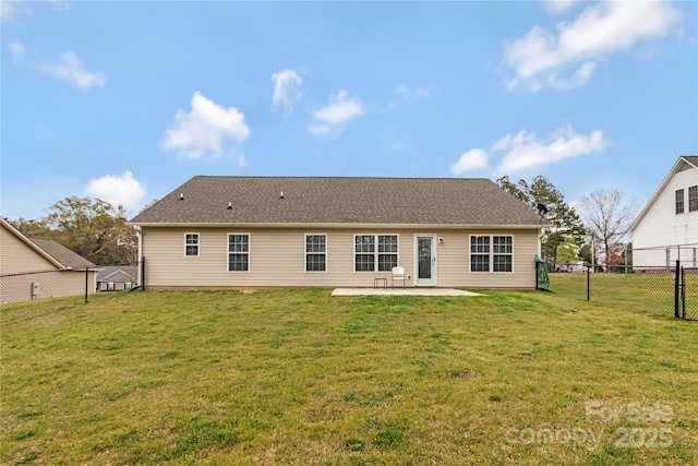 back of house with a lawn, a fenced backyard, and a patio area